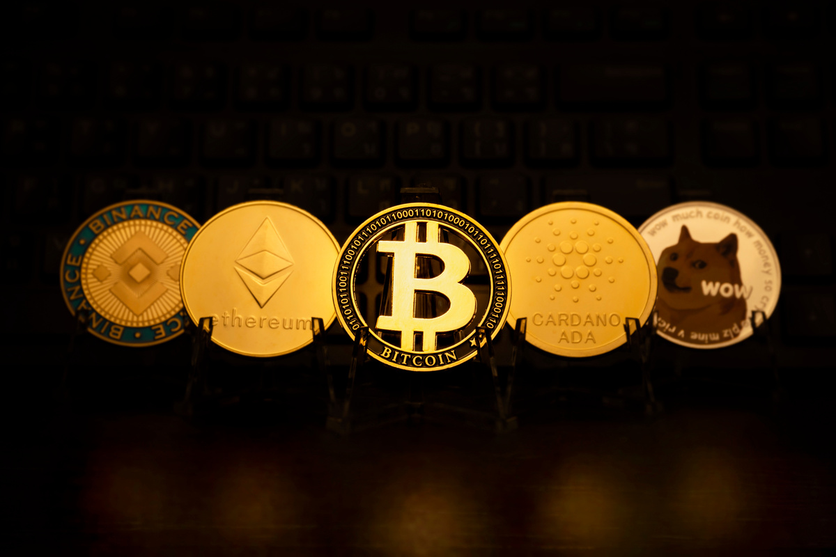 Gold Bitcoin and Stack of Crypto on Dark Background